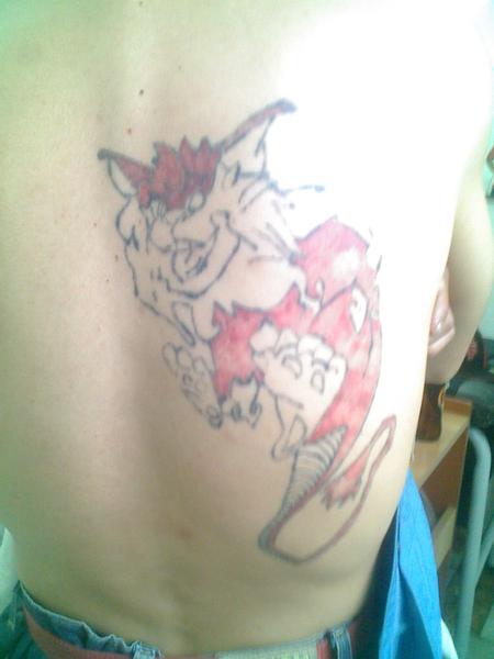 Bad Tattoos - Angry cat-dragon tattoo.